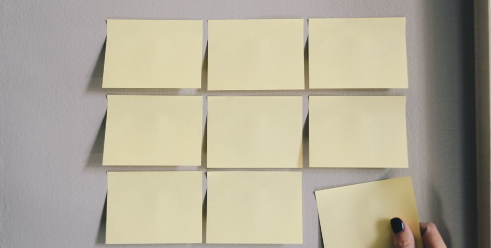 Six empty Post-It notes on a wall