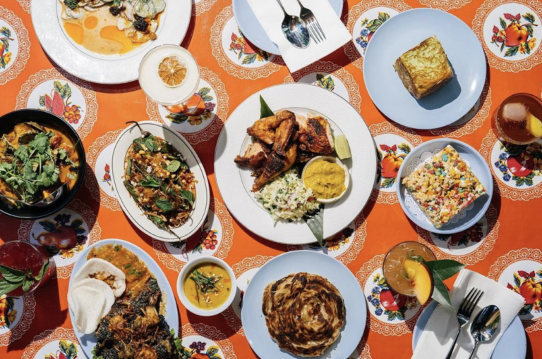Assortment of dishes from Oma's Hideaway on an orange tablecloth